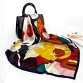 Chic satin square scarf with colorful paisley print draped over a black leather handbag - 90x90cm / Deep Blue (D9194)