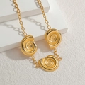 Golden necklace with triple spiral shell pendants on a thick chain over geometric stones - 3 Snail Spiral Pendants (N2178) / Gold