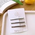 Three silver Y2K hollow metal hair clips on white card with tulip and book background - Bar Style / Set of 3