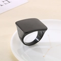 Detail of square black titanium ring with a brushed matte finish on a ceramic plate - US 6 / Brushed Black