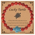 Handmade beaded bracelet with red turquoise beads and a sky blue turtle charm on a card - Red Howlite