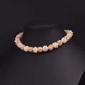 Vintage multi-strand pearl necklace in white and pink tones on a black stand - Pink Flower Ball Choker
