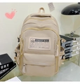 Detailed view of beige large-capacity backpack with functional zippers in a cozy study setting - Basic Style / Khaki