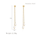 Long pearl tassel drop earrings in golden stainless steel featuring white pearl accents - Gold (LE3067)