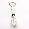 Detailed macro view of white hand-woven cotton macrame net bag for crystal necklace pendant - Keychain / White