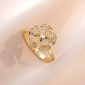 Elegant rotating sunflower ring in gold finish with sparkling clear cubic zirconia stones - Camellia Rotating Ring (J0229) / Gold