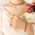 Elegant gold jewelry set featuring vibrant red zircon stones on a necklace and bracelet - Red Zircon Necklace-37cm