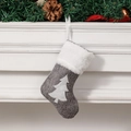 Grey linen Christmas stocking with white tree pattern hanging on a festive fireplace - Grey Christmas Tree