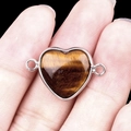 Tiger eye heart stone connector with silver bezel held on finger for size scale - Tiger Eye Double Hole (Silver)