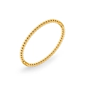 Detailed macro view of 18k gold plated beaded bangle with polished mirror finish - Gold Beaded