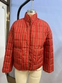 Padded jacket with red and brown vertical stripes featuring a high collar and front pockets - Red and Black Stripes