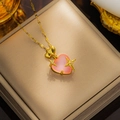 Detailed close-up of golden necklace featuring a pink heart pendant with starry accents - Pink(8808)