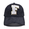 Close-up of distressed baseball cap with white towel embroidered letter F and sequins - Letter F Style (F-漏洞马尾棒球帽)
