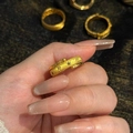 Detailed macro view of a vintage gold-plated star and sun ring with small blue zircons - Open Adjustable Style / Gold-Blue