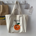 Detail of cream canvas tote bag featuring orange cartoon print and Hello text - HELLO (Large Capacity)
