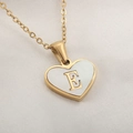 Delicate heart-shaped necklace with white shell inlay and gold letter E pendant - Letter E