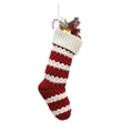 Knitted Christmas stocking with red and white stripes filled with festive ornaments - Red