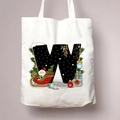 White canvas Christmas tote bag featuring a decorative letter W and festive holiday patterns - Letter W