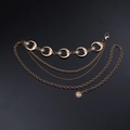 Detail of multi-layer gold alloy waist chain with sun, moon, and star charms - Gold Moon Triple Layer