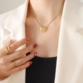 Golden titanium steel set featuring geometric bar pendant necklace and textured rings - 40+5cm / Gold