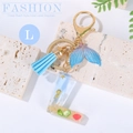 Ocean-themed resin initial L keychain with blue tassel and gradient whale tail pendant - Letter L