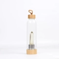 Bamboo glass water bottle with natural hexagonal crystal column and a carrying strap - Citrine Bottle