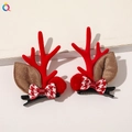 Detail of Christmas reindeer antler hair clips with plush balls and checkered bows - Christmas Antler Hair Clips - Bowknot Pom Red
