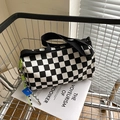 Chic black and white checkerboard barrel bag with green rope and wide strap - Black