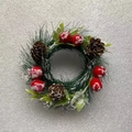 Close-up of mini Christmas wreath with pine cones and red berries covered in artificial snow - Snow Powder Needle and Red Berry
