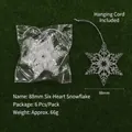 Clear plastic snowflake ornaments with heart cutout and silver string on green grass - Six Hearts Combined Snowflake / 88mm