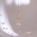 Close-up of golden sun and crescent moon suncatcher with purple amethyst crystal drops - Style 2-Sun and Moon Amethyst Pendant