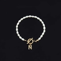 Elegant gold OT toggle pearl bracelet with a sparkling diamond-studded letter N pendant - Gold Letter N (SL2013)