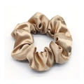 Elegant champagne gold satin scrunchie with a luxurious silk texture on white background - Champagne