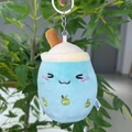 Detailed view of light blue plush bubble tea cup keychain with cute embroidered face - 11cm / Blue Squint