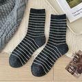 Dark grey wool blend socks with white horizontal stripes on cozy plush background - One Size / Dark Gray
