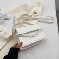 Modern white quilted crossbody bag with a matte plastic chain and minimalist design - White