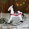 White Nordic style iron rocking horse ornament with red and green painted Christmas details - White