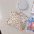 Detail of floral cotton mini pouch featuring pink flowers, white zipper and woven puller - Pink Marble Pattern
