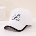 Detail of embroidered 'talk to me' text on a stylish white baseball cap with black piping - 52cm / White