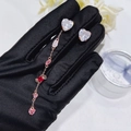 Detailed view of rose gold asymmetrical earrings with pink and red heart-shaped crystals - Candy Stud Earrings (Detachable)