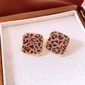 Detail shot of leopard print square earrings with golden metal edges in a jewelry box - Gold Leopard Print (Silver Pin)