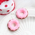 Macro shot of two pink glazed mini donut resin charms for DIY craft phone case accessories - Donut-Pink