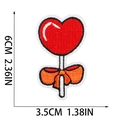 Detail view of heart lollipop embroidered patch with measurements in 6cm x 3.5cm - Heart Lollipop (W25SG-068-29)