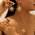 Exaggerated golden sunflower jewelry set including necklace, earrings and ring on model - Sun Motif Jewelry Set (Earrings + Necklace + Ring)