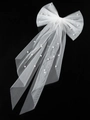 Short white bridal veil with bow and faux pearls decoration on minimalist black background - Bow Veil Style 1