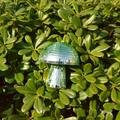 Close-up of green mushroom disco ball ornament with mirror tiles in garden - 10*10CM / Green