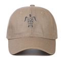 Detailed close-up of khaki cotton baseball cap featuring high-quality grey turtle embroidery - Khaki