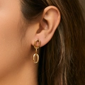 Close-up of model wearing gold-plated double-loop heart earrings with smooth metallic finish - Oval Double Loop Chain - Gold (KE1442)