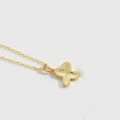 Minimalist gold necklace featuring a delicate cross flower pendant with hammered texture - Letter X