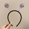 Halloween headband with silver glittery skulls and red heart eyes on spring coils - Skull Alien